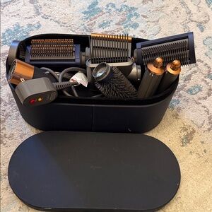 Not working, for parts or repair. Dyson Black and Gold Hair Styling Kit